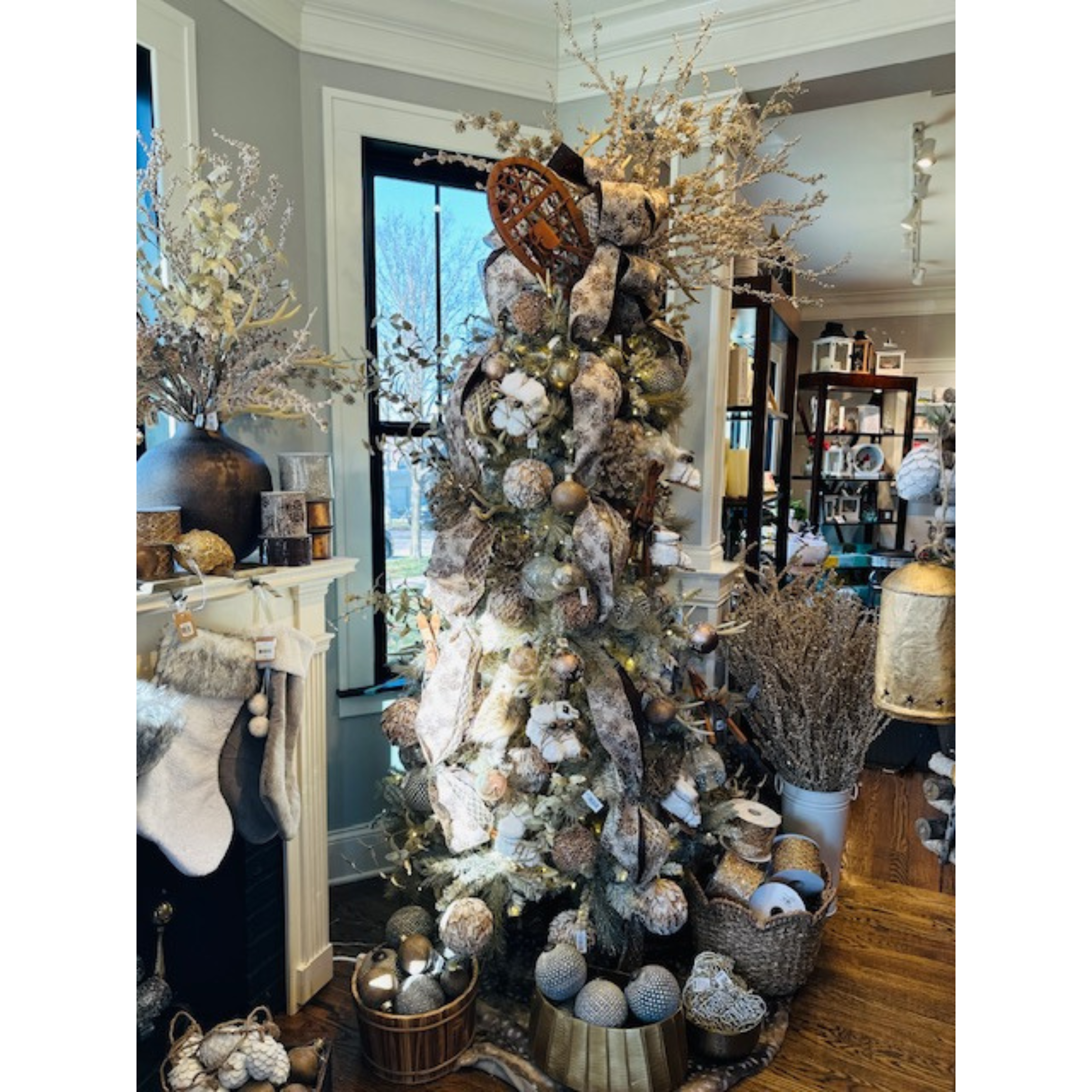 Decorated holiday tree with ornaments and festive decor at Melrose on Main boutique