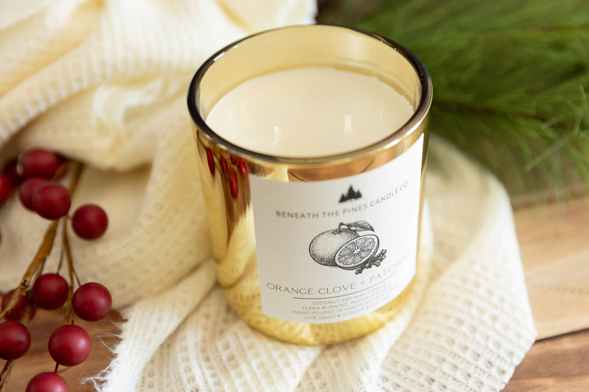 Beneath The Pines Candle Co. Orange Clove and Patchouli soy candle in glass jar