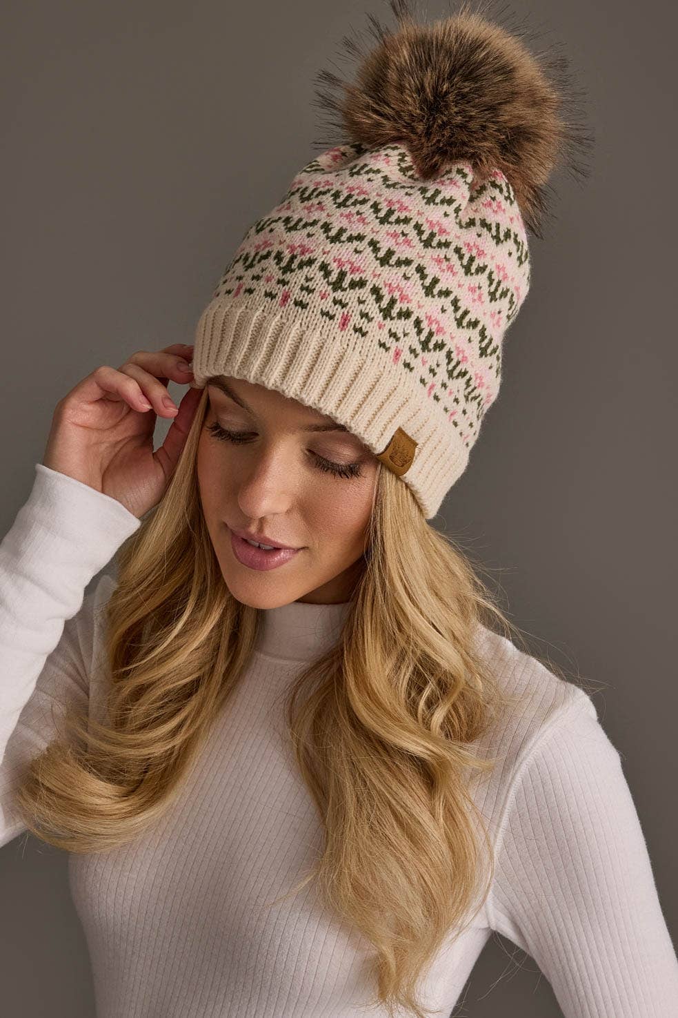 Panache Apparel Co. cream and pink floral knit pom hat with faux fur pom