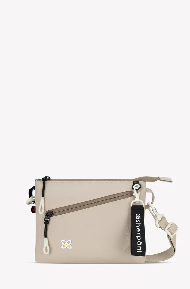 Sherpani Zoom slim RFID crossbody, con leche, front view