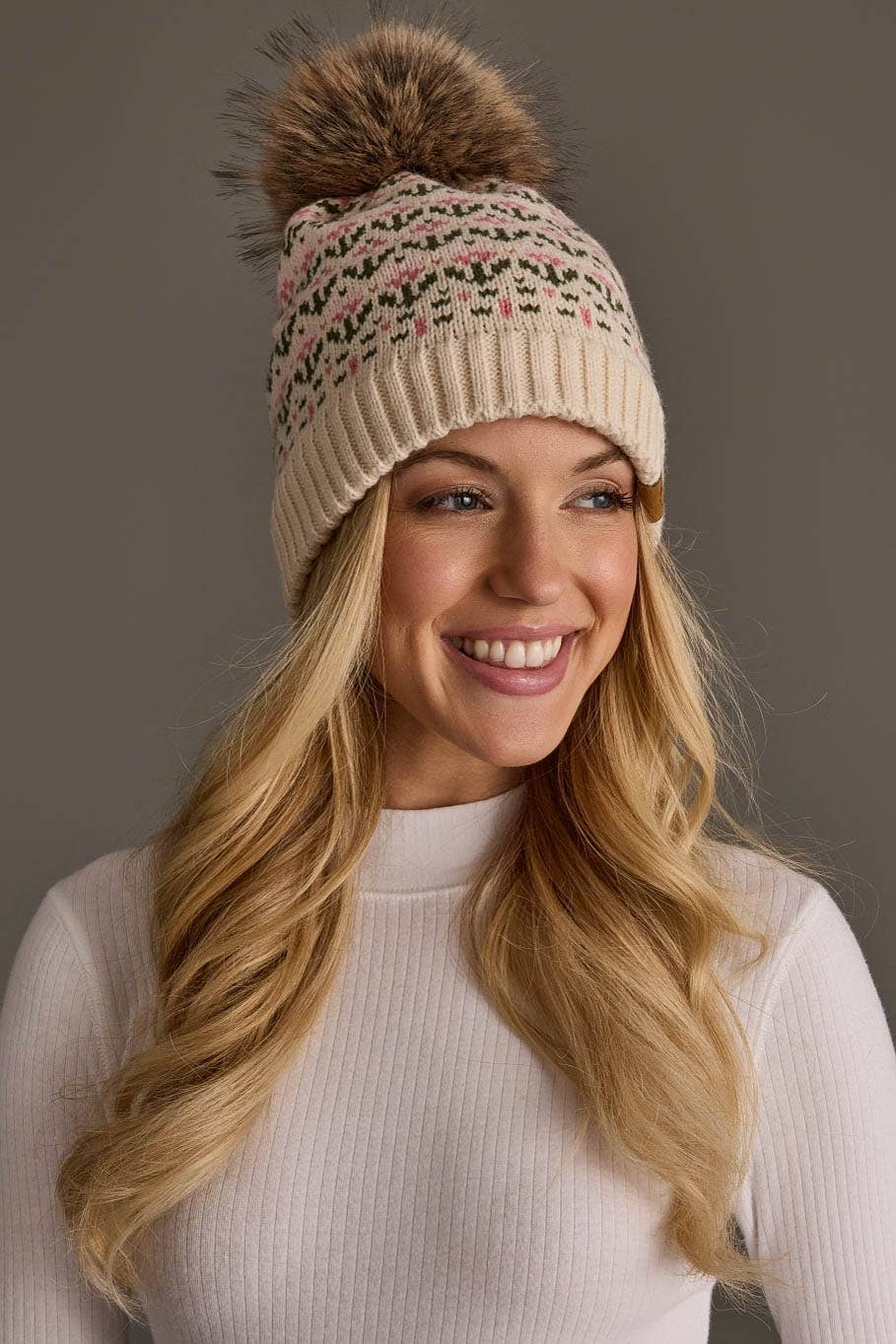Panache Apparel Co. cream and pink floral knit pom hat with faux fur pom