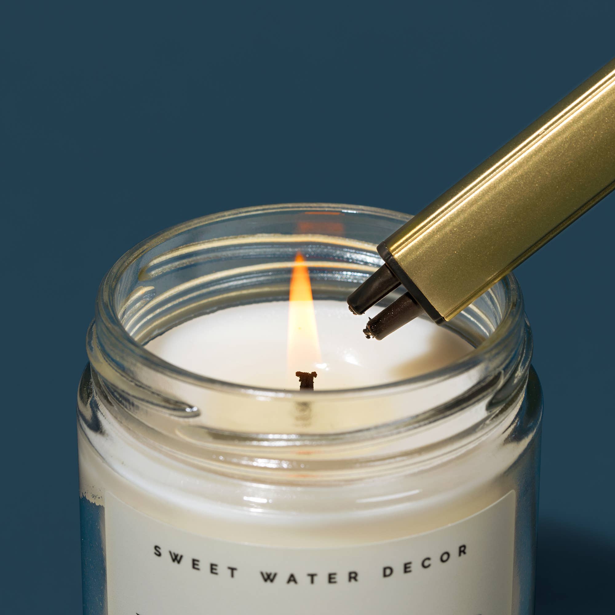 Sweet Water Decor gold electric lighter, detail view