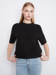 Black elbow sleeve sweater by Charlie B with mock neckline and button detail at the cuffs