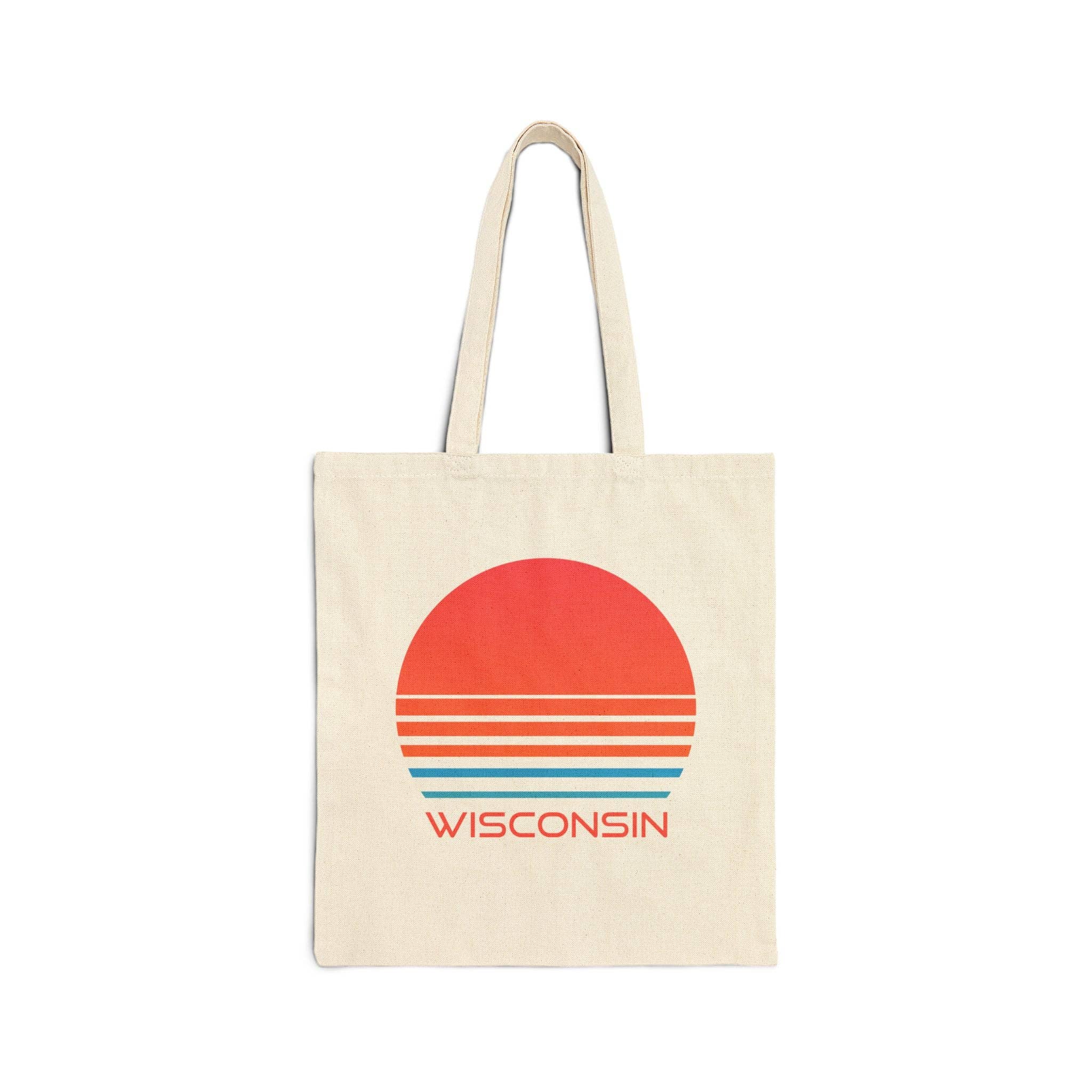 A natural canvas tote bag with a retro sunset graphic in red, orange, and blue, featuring the word 'WISCONSIN' printed below the sun.