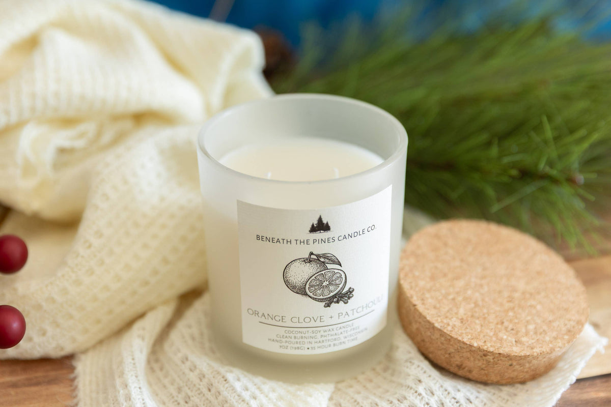 Beneath The Pines Candle Co. Orange Clove and Patchouli soy candle in glass jar