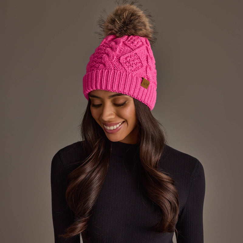 Panache Apparel Co. bright pink cable knit pom hat with faux fur pom