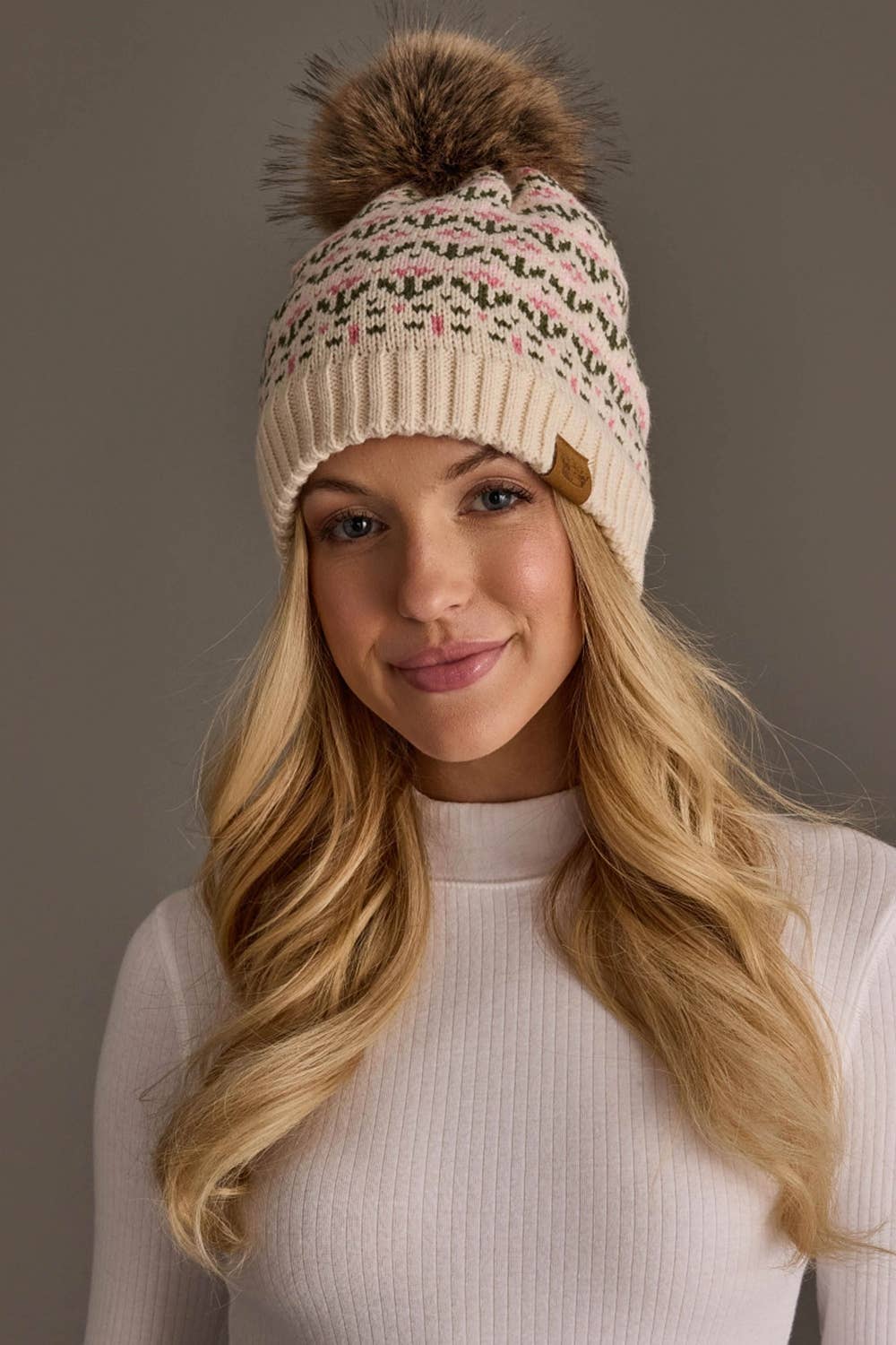 Panache Apparel Co. cream and pink floral knit pom hat with faux fur pom