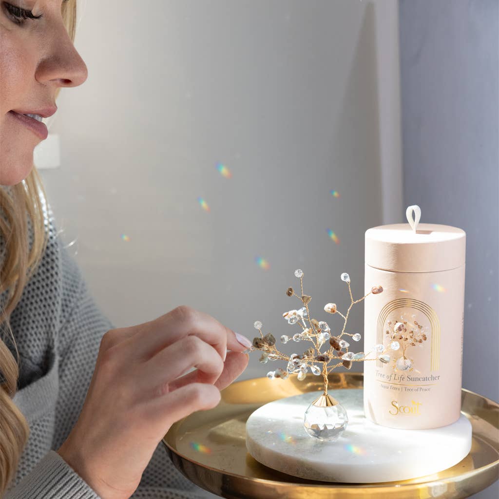 Scout Curated Wears Tree of Life suncatcher in Aqua Terra, Peace, with gold