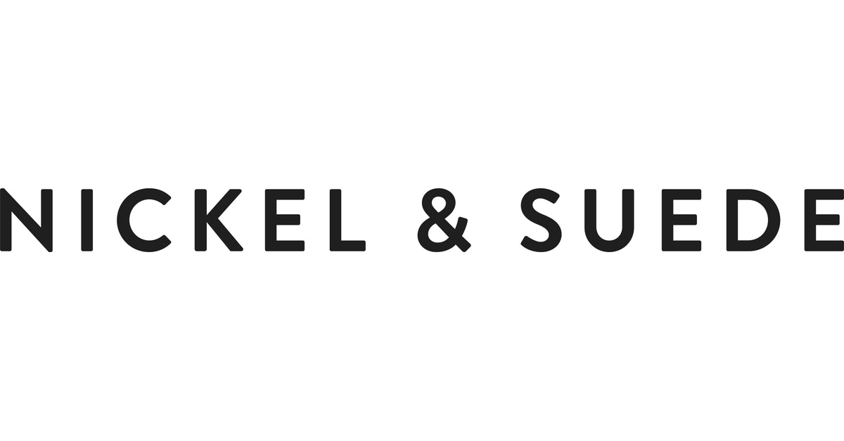 The text 'NICKEL & SUEDE' in a bold, black sans-serif typeface on a solid white background.